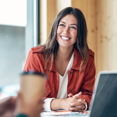 Smiling accountant in her office