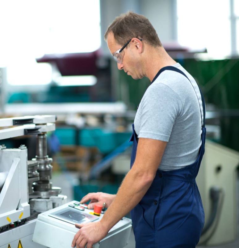 Man operating machine in warehouse